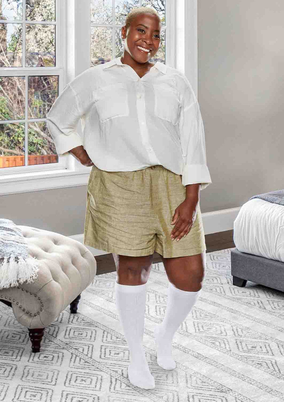 Woman wearing Core-Spun moderate support compression socks in white